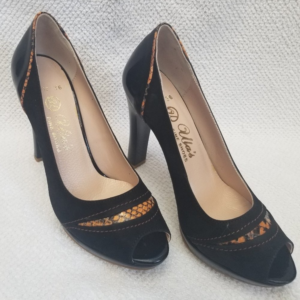 Black and Orange trim all leather new and unworn pumps